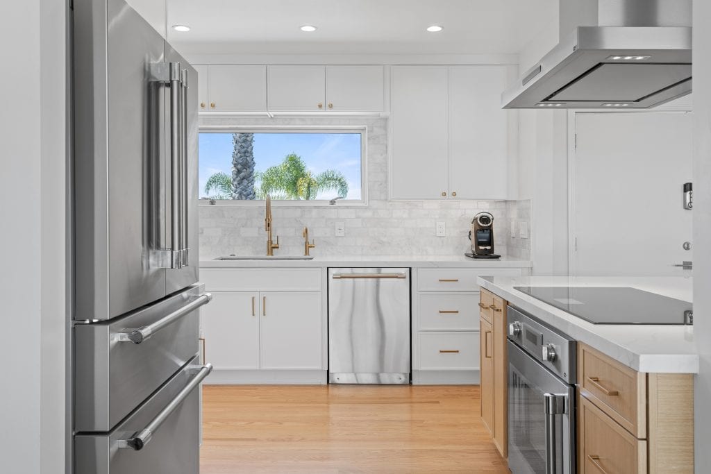 Kitchen remodel with marble backsplash in Manhattan Beach by Optima Design & Build