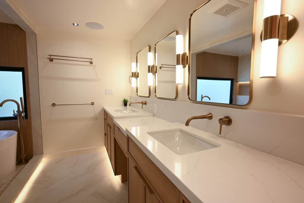 Rancho Palos Verdes primary bathroom remodel - double vanity, brass mirrors and LED cove lighting