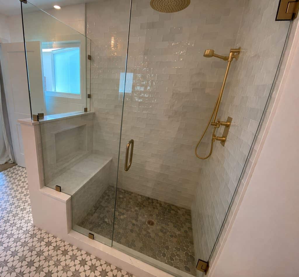 Marina del Rey bathroom remodel - walk-in shower with zellige-style tile, brushed brass fixtures and built-in bench