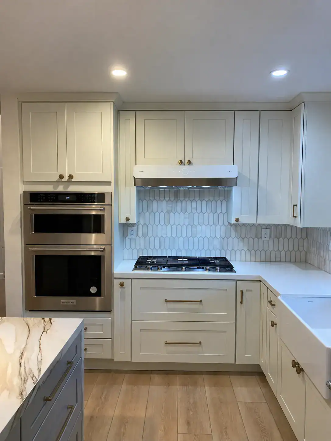 Santa Monica kitchen remodel with cream shaker cabinets and porcelain waterfall island